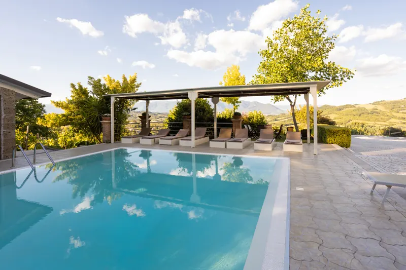 Infinity pool at Villa ai Tre Ulivi at sunset