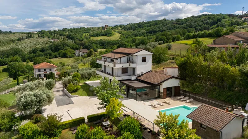 Aerial view of Villa Santoro ai Tre Ulivi among olive groves and the Caiazzo hills